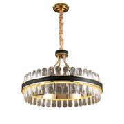 round crystal chandelier with leather and gold