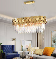 oval crystal chandelier with gold discs hanging in living room