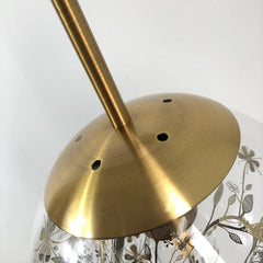 top of wall sconce globe showing gold body
