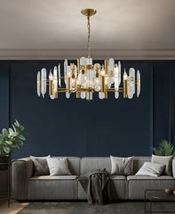 round crystal chandelier hanging in dark contemporary living room