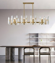 linear crystal chandelier hanging in dining area