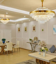 two round conical crystal chandeliers in open floor plan living and dining room