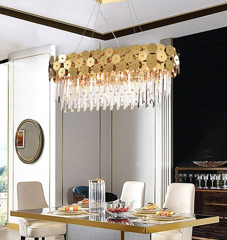 oval crystal chandelier with gold discs hanging in dining room