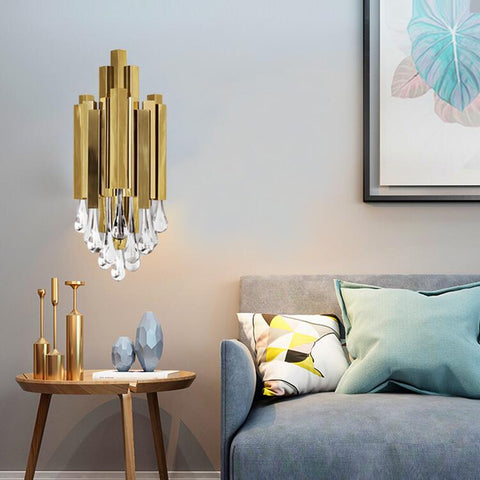 gold wall sconce with water drop crystals in living room