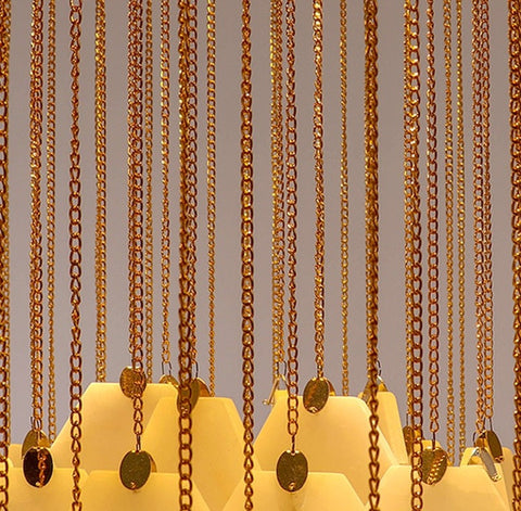 This Chandelier features Beautifully Designed Chains with a Gold Finish..
