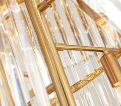 precision cut crystal bars attached to gold lamp body