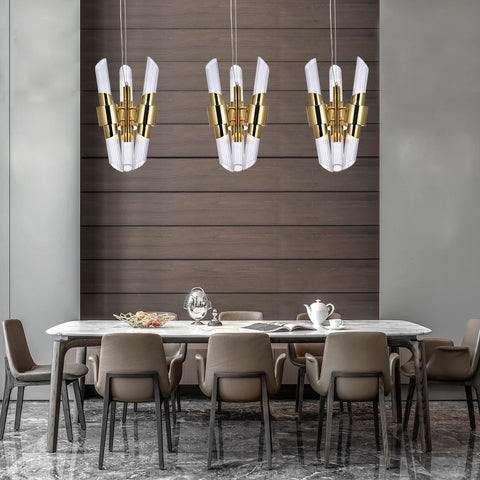 three gold and glass chandeliers hanging over dining room table