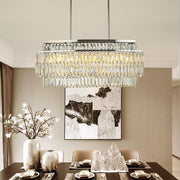 3 tier modern crystal silver chandelier hanging in luxury dining room