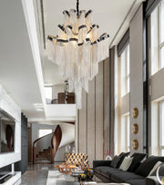 silver chain tassel chandelier hanging in two story living room