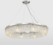 crystal round hover chandelier with silver body hanging and lit