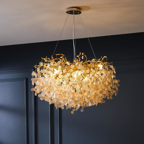 round gold branch style capiz shell chandelier illuminated