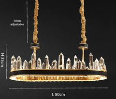 oval gold chandelier with leather bank and obelisk shaped crystals with dimensions of 80 cm length and 35 cm height