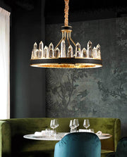 round crystal chandelier with leather and gold over dining table