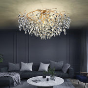 precision cut lead crystal chandelier with gold branches in living room