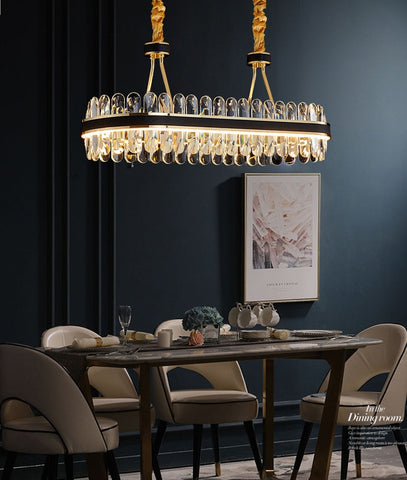 oval crystal chandelier over dining room table