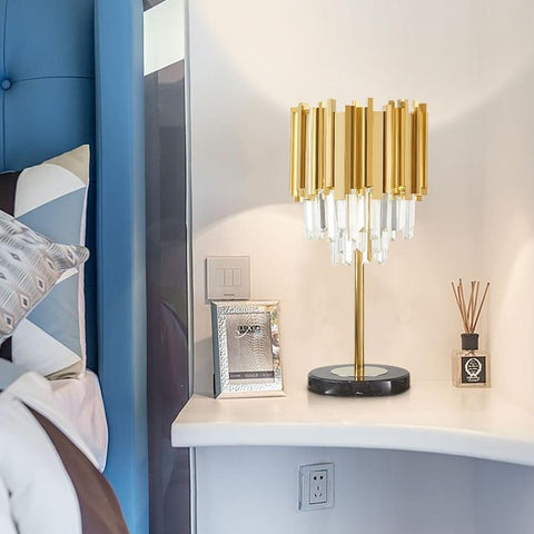 gold and crystal lamp on bedside table