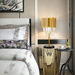 gold and crystal lamp on bedside table