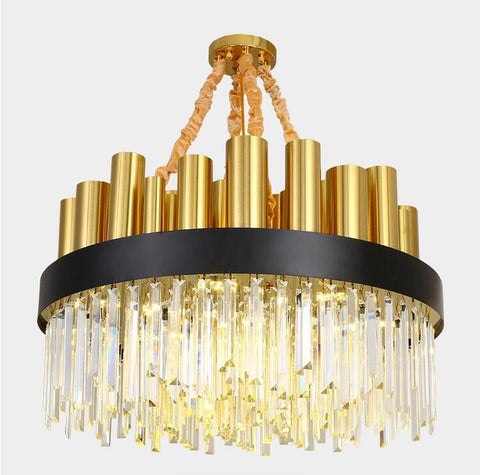 round crystal chandelier with black and gold frame illuminated
