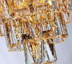 detail of precision cut crystals on bottom of conical gold crystal chandelier
