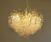 capiz shell gold chandelier with frosted crystals illuminated