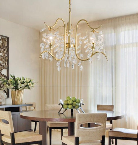 gold and crystal chandelier in dining space