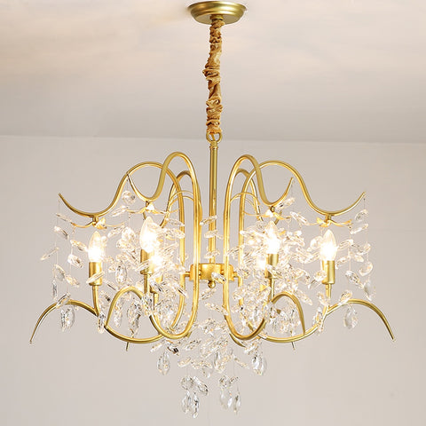 gold and crystal unique chandelier illuminated