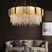 golden round chandelier with crystal drop in living room
