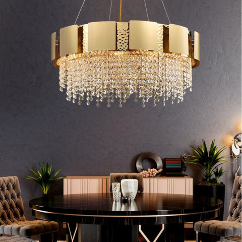 golden round chandelier with crystal drops in dining room