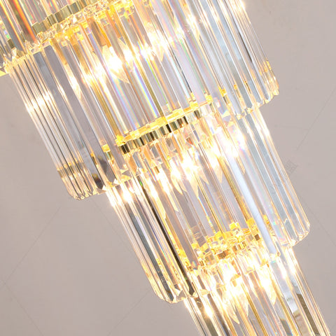 close up of illuminated crystal rods forming bottom 3 tiers of 9 tier chandelier