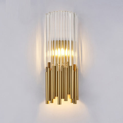 gold and clear crystal tubular wall sconce illuminated