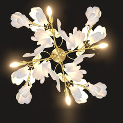 gold stem wall sconce with white ceramic flowers in 4 branch pattern