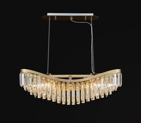 gold chandelier with long body and rectangular crystals hanging down in a boat shape short version