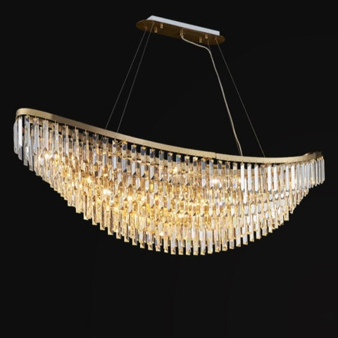 gold chandelier with long body and rectangular crystals hanging down in a boat shape