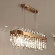 oval crystal chandelier with gold body illuminated