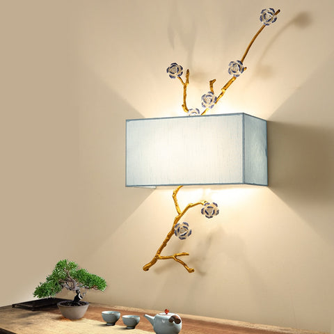 illuminated floral branch wall sconce with shade