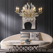 lily bud crystal and gold chandelier on chain over couch in luxury living room
